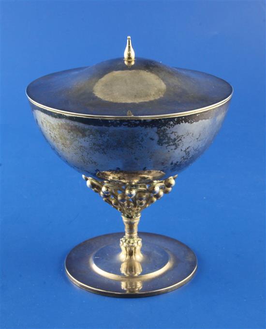 An early 20th century Georg Jensen planished sterling silver bonbonniere and cover, no.43 designed by Johan Rohde,